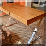 F14. Contemporary wood and chrome desk. 29.5”h x 47”w x 23”d 